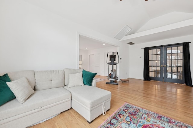 45 Nichols Rd, Huntington Station, NY 11746 - living area featuring french doors, light wood-style flooring, lofted ceiling, and a ceiling fan