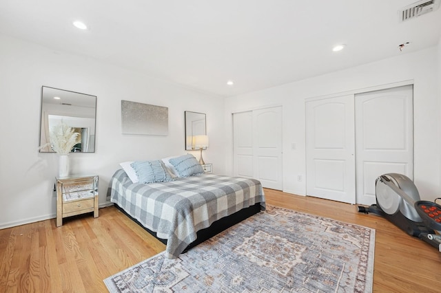 45 Nichols Rd, Huntington Station, NY 11746 - bedroom with light wood-type flooring, recessed lighting, multiple closets, and visible vents