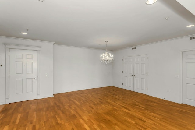 100 Harbor View Dr Unit 249, Port Washington, NY 11050 - spare room with ornamental molding, wood finished floors, and a chandelier