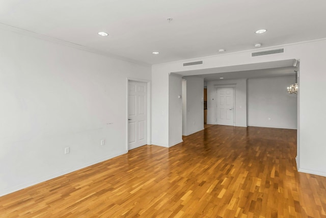 100 Harbor View Dr Unit 249, Port Washington, NY 11050 - empty room with crown molding, visible vents, a notable chandelier, and light wood finished floors
