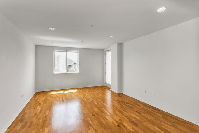 100 Harbor View Dr Unit 249, Port Washington, NY 11050 - spare room featuring baseboards, recessed lighting, and light wood finished floors