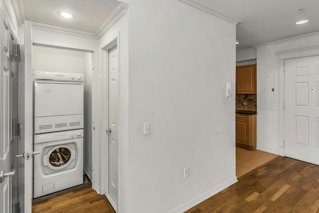 100 Harbor View Dr Unit 249, Port Washington, NY 11050 - laundry room with laundry area, ornamental molding, stacked washer / drying machine, and wood finished floors