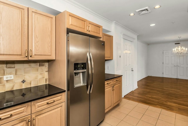 100 Harbor View Dr Unit 249, Port Washington, NY 11050 - kitchen with dark countertops, stainless steel fridge, recessed lighting, light tile patterned floors, and ornamental molding