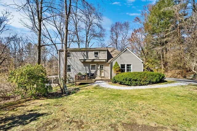 65 Hickory Ln, Bedford, NY 10506 - view of front of house featuring a deck and a front yard