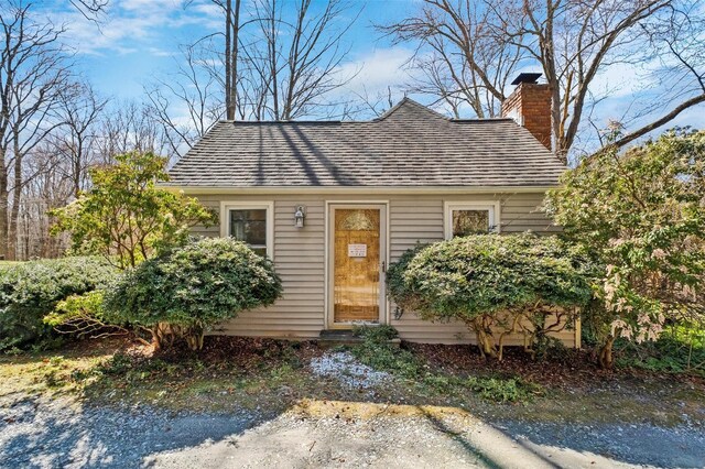 65 Hickory Ln, Bedford, NY 10506 - view of front of home with a chimney