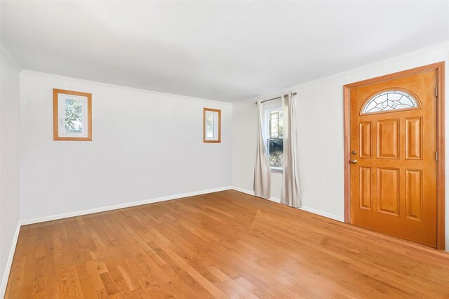 65 Hickory Ln, Bedford, NY 10506 - entryway with baseboards, ornamental molding, and light wood-style flooring