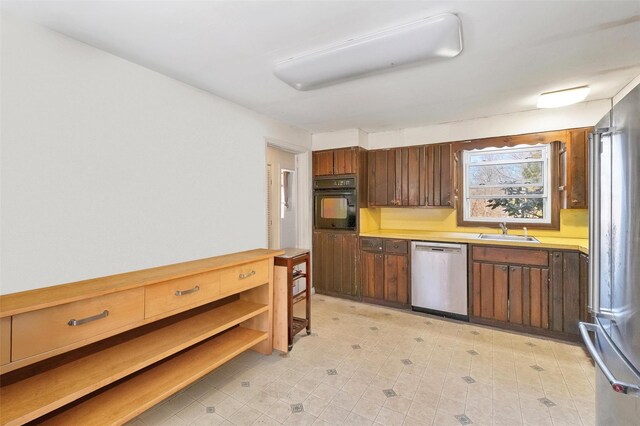 65 Hickory Ln, Bedford, NY 10506 - kitchen featuring light countertops, a sink, and stainless steel appliances