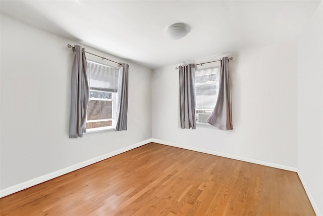65 Hickory Ln, Bedford, NY 10506 - empty room with baseboards, a wealth of natural light, and wood finished floors