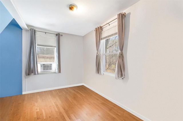 65 Hickory Ln, Bedford, NY 10506 - spare room with baseboards, wood finished floors, and cooling unit