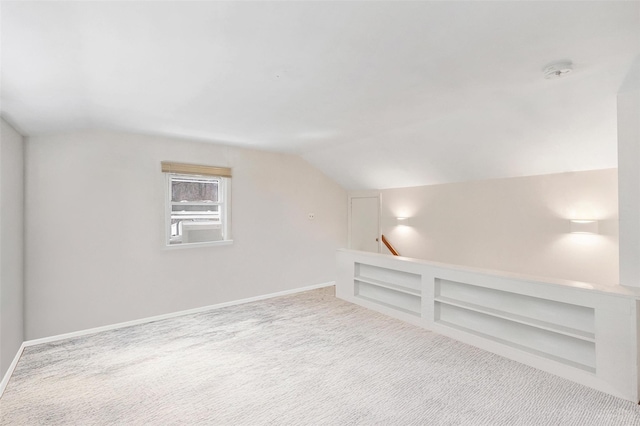 65 Hickory Ln, Bedford, NY 10506 - additional living space featuring carpet flooring, baseboards, and lofted ceiling