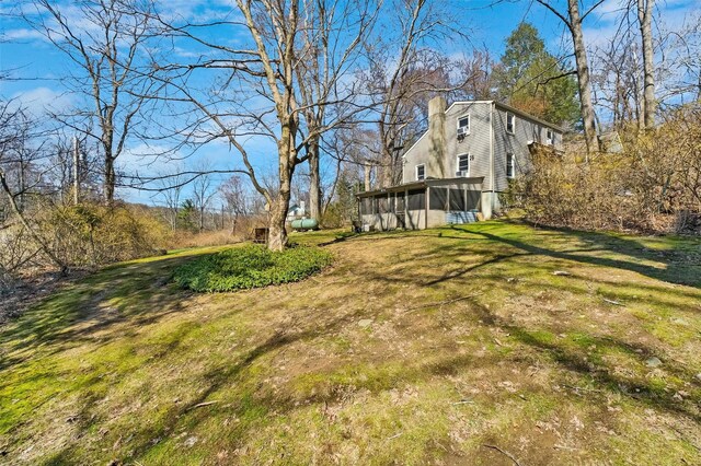 65 Hickory Ln, Bedford, NY 10506 - view of yard featuring a sunroom