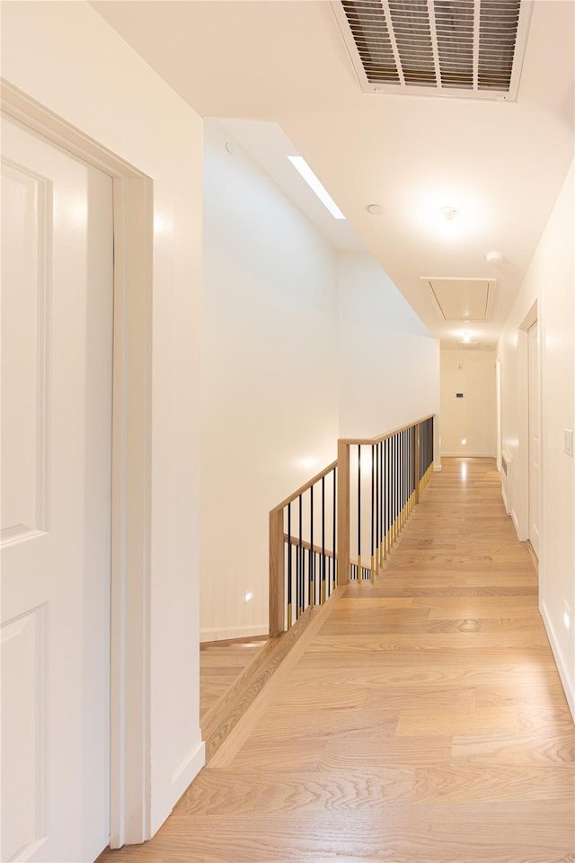 3 Carlton Rd Unit 201, Monsey, NY 10952 - hall with attic access, visible vents, baseboards, and light wood-style floors