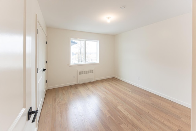 3 Carlton Rd Unit 201, Monsey, NY 10952 - unfurnished room featuring baseboards, radiator heating unit, and light wood-style floors