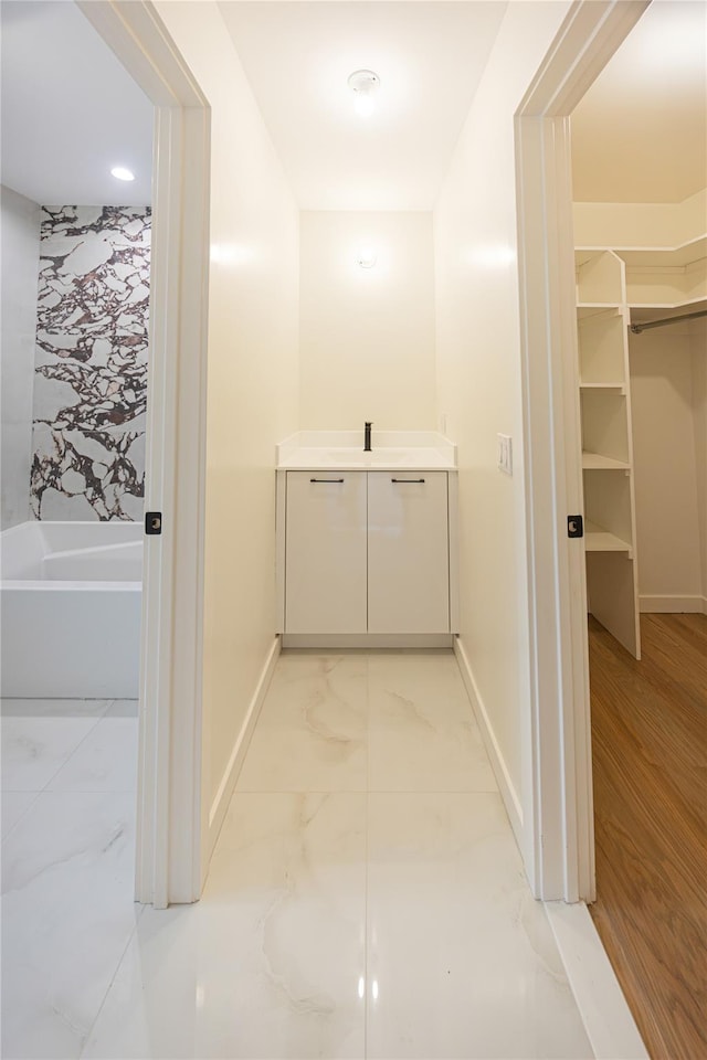 3 Carlton Rd Unit 201, Monsey, NY 10952 - hallway with baseboards, a sink, and marble finish floor