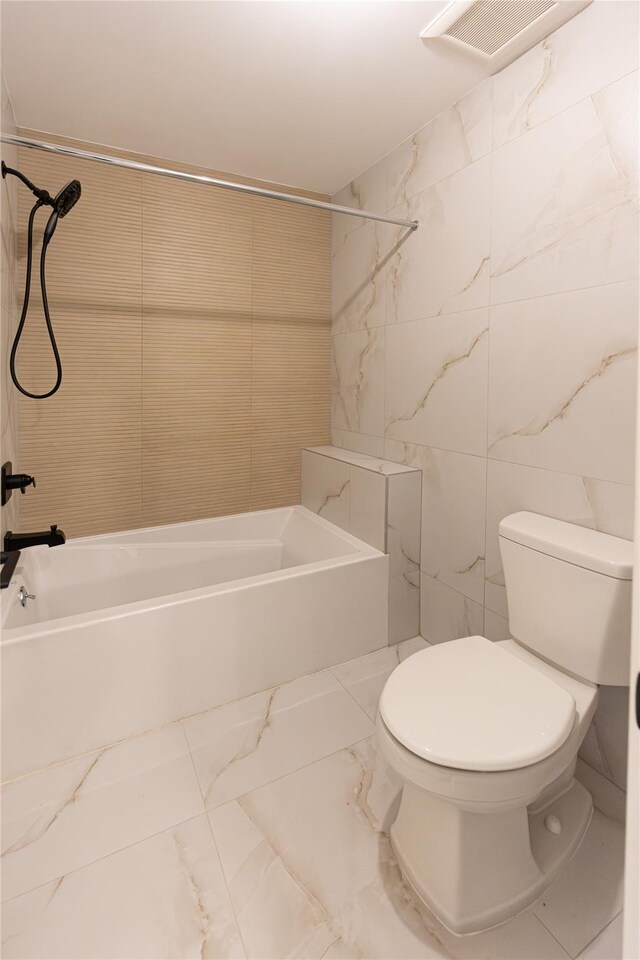 3 Carlton Rd Unit 201, Monsey, NY 10952 - full bathroom with washtub / shower combination, visible vents, toilet, tile walls, and marble finish floor