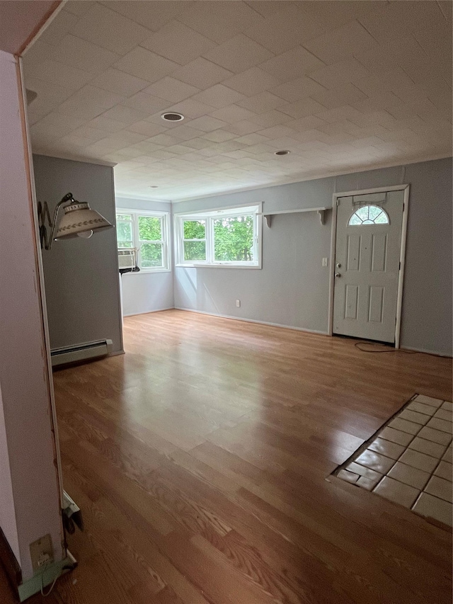7-9 Wilbur Ave, Middletown, NY 10940 - foyer with a baseboard heating unit and wood finished floors