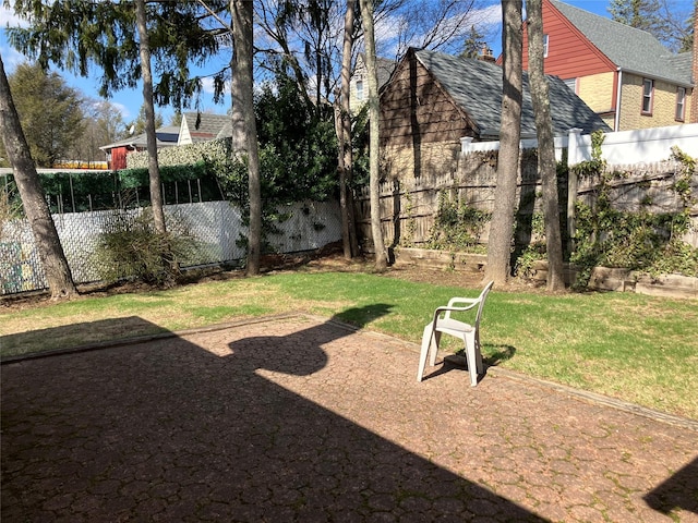 view of yard with a fenced backyard