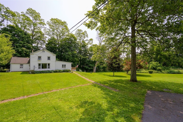 126-128 Christian Hill Rd, Dover Plains, NY 12522 - view of grassy yard with view of wooded area