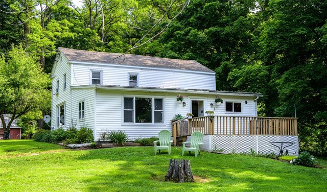 126-128 Christian Hill Rd, Dover Plains, NY 12522 - view of front facade featuring a wooden deck, a front yard, and a shingled roof