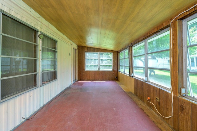 126-128 Christian Hill Rd, Dover Plains, NY 12522 - unfurnished sunroom with wood walls, plenty of natural light, wood ceiling, and concrete floors