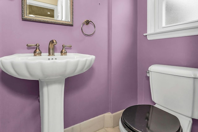 319 Maryland Ave, Freeport, NY 11520 - bathroom featuring toilet and a sink