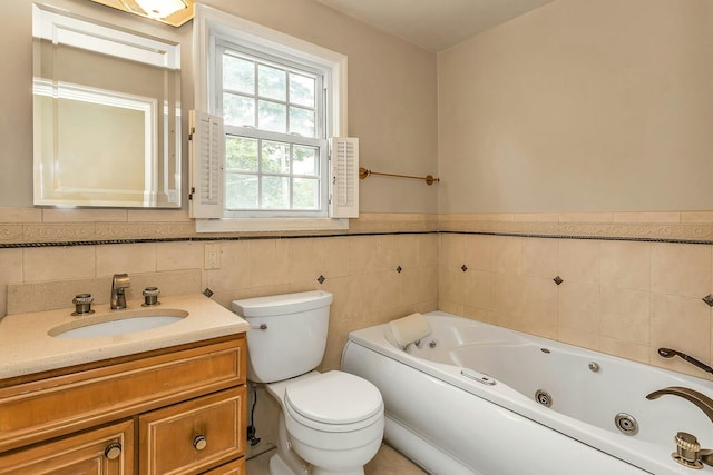 319 Maryland Ave, Freeport, NY 11520 - full bath with a tub with jets, toilet, vanity, wainscoting, and tile walls