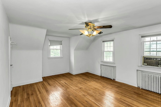 319 Maryland Ave, Freeport, NY 11520 - bonus room with radiator, light wood finished floors, a ceiling fan, cooling unit, and vaulted ceiling