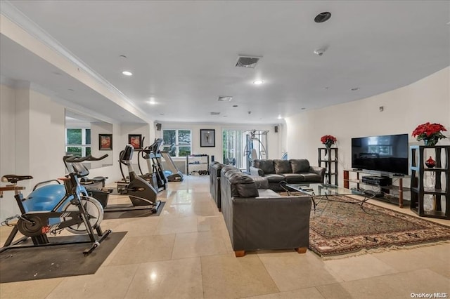 living room featuring light tile patterned flooring, visible vents, crown molding, and recessed lighting
