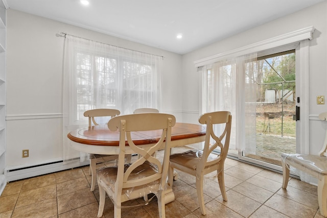 dining room with recessed lighting, light tile patterned floors, and a baseboard radiator