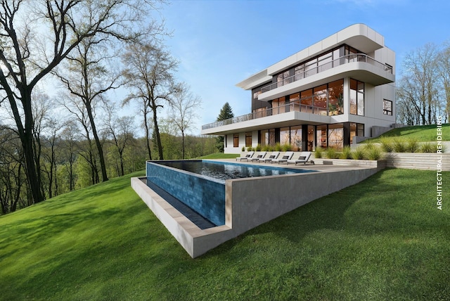 back of house with an outdoor pool, a balcony, a patio area, and a lawn
