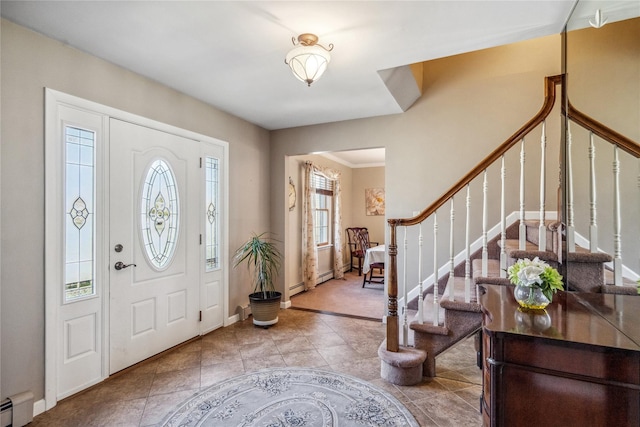tiled entrance foyer featuring baseboards, stairs, and baseboard heating