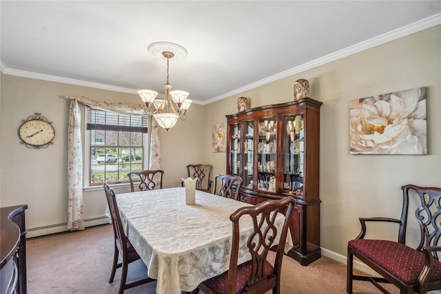 dining area with a notable chandelier, crown molding, and carpet flooring