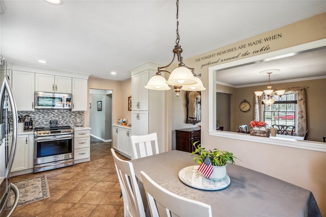 dining space with light tile patterned floors, crown molding, recessed lighting, and an inviting chandelier