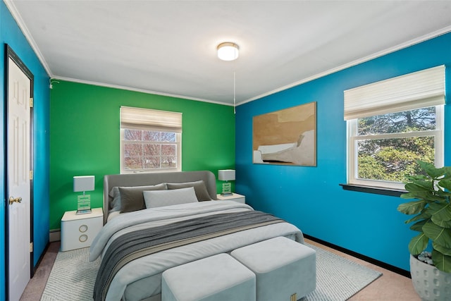 carpeted bedroom with baseboards, crown molding, and a baseboard radiator