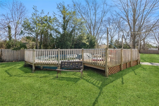 view of yard with fence and a deck