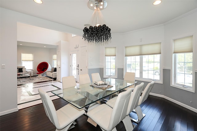 dining space featuring a chandelier, plenty of natural light, dark wood-style floors, recessed lighting, and crown molding