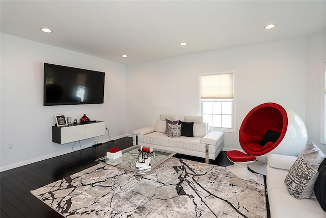 living room with wood finished floors, recessed lighting, and baseboards
