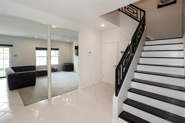 staircase with carpet floors, recessed lighting, baseboards, and tile patterned floors