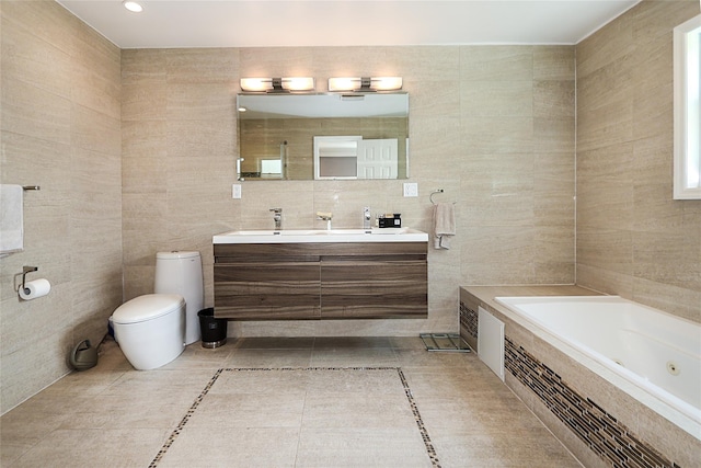 full bath with tile walls, toilet, double vanity, a jetted tub, and tile patterned flooring