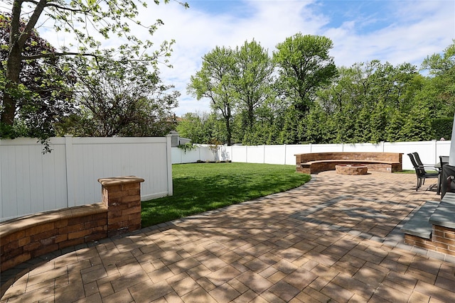 view of patio / terrace featuring a fire pit