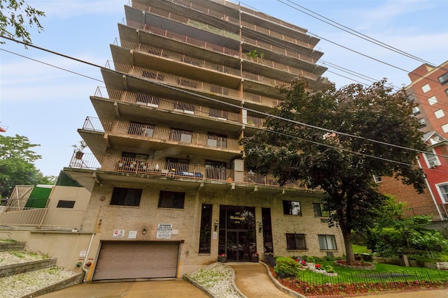 687 Bronx River Rd # 2A, Yonkers, NY 10704 - view of property featuring an attached garage and driveway