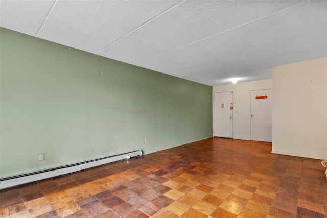 687 Bronx River Rd # 2A, Yonkers, NY 10704 - unfurnished room with a baseboard radiator and a textured ceiling