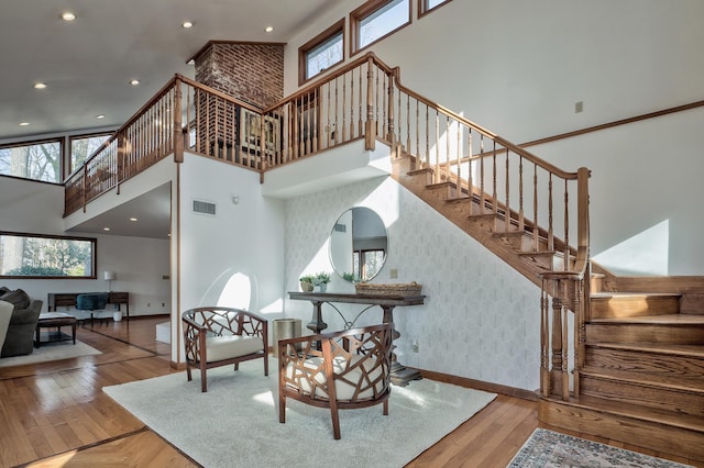 4 Sloanes Ct, Sands Point, NY 11050 - stairs with baseboards, wallpapered walls, a towering ceiling, and parquet flooring