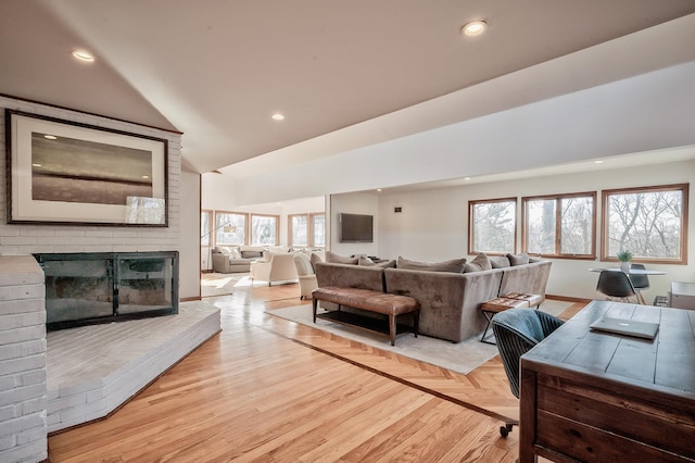 4 Sloanes Ct, Sands Point, NY 11050 - living area with lofted ceiling, recessed lighting, and a brick fireplace