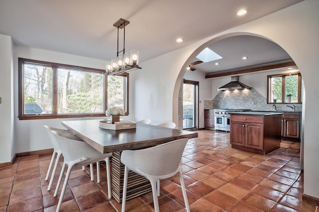 4 Sloanes Ct, Sands Point, NY 11050 - dining area featuring arched walkways, baseboards, and recessed lighting