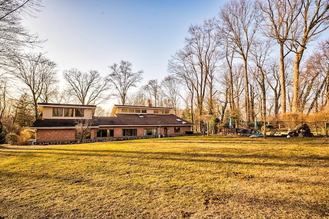 4 Sloanes Ct, Sands Point, NY 11050 - exterior space with brick siding, fence, and a yard