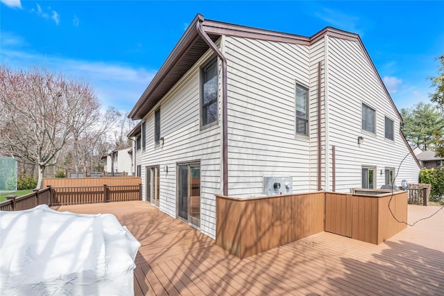 view of side of home with a wooden deck
