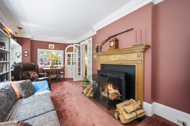 living area featuring a warm lit fireplace, carpet floors, and ornamental molding