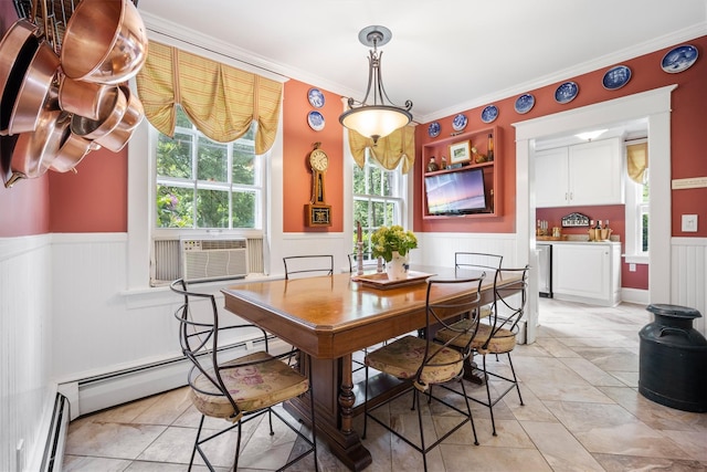 dining space featuring cooling unit, a baseboard heating unit, ornamental molding, a wainscoted wall, and a baseboard radiator