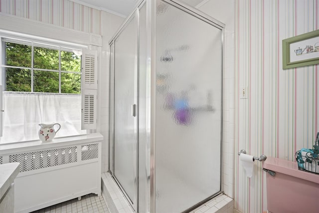 full bathroom with tile patterned flooring, radiator, and a stall shower